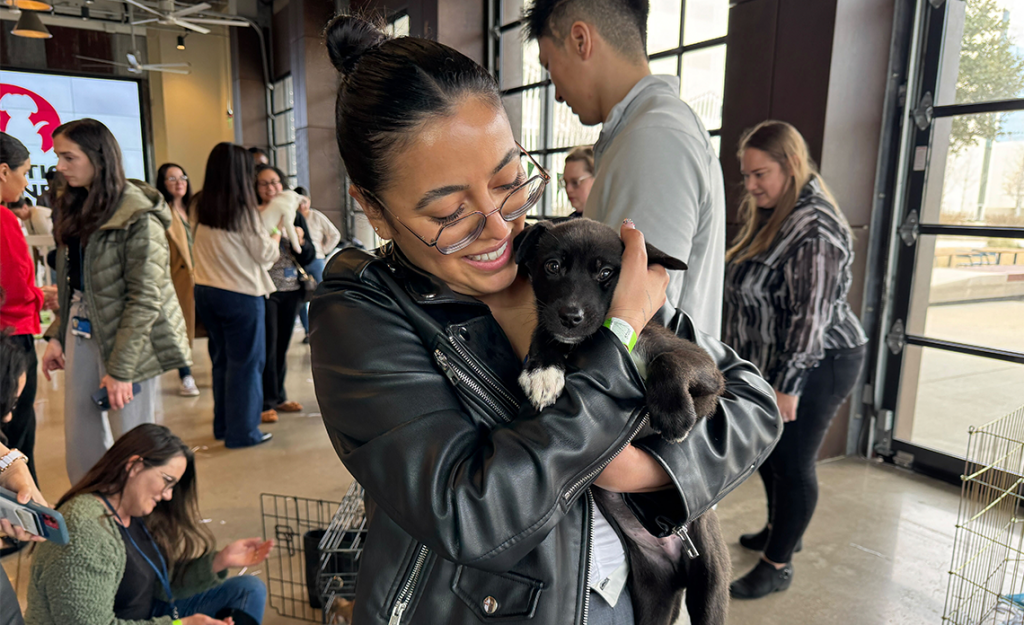 JPMorganChase employee holding puppy