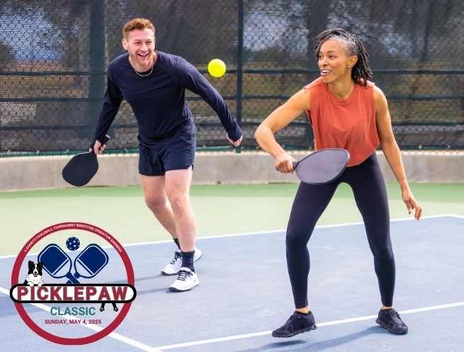 Couple playing pickleball